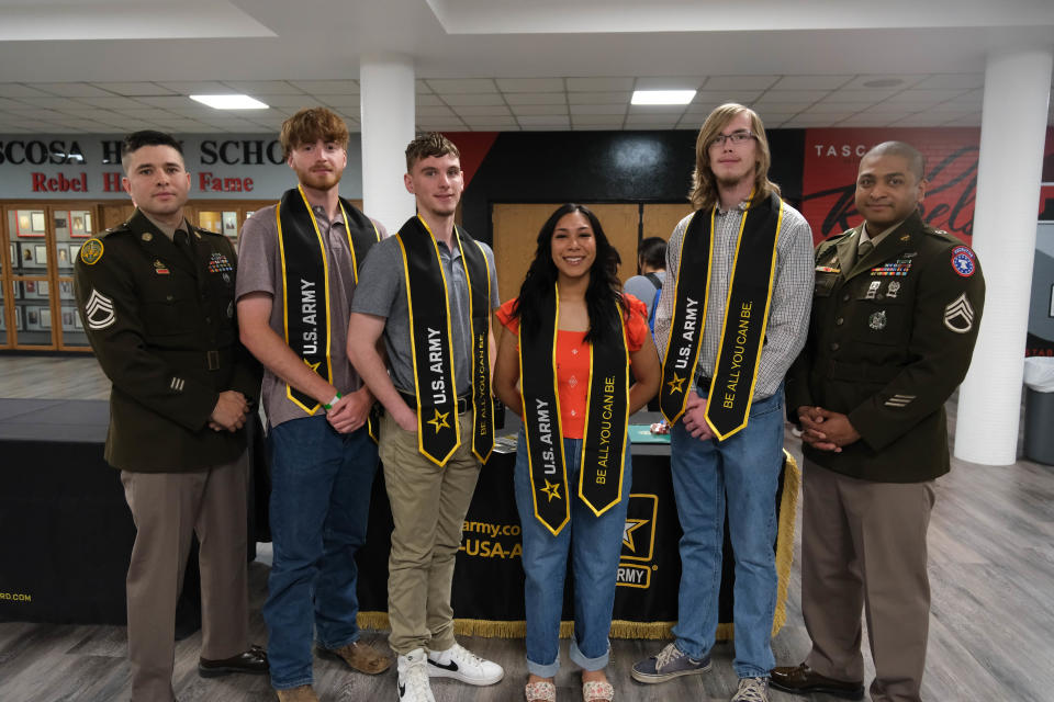 Charles Spinhirne (second from left), Cole Nichols, Lauren Apodaca and Alexander Walker stand with their military recruiters SFC Rodriguez and SSG Varnum Tuesday at Tascosa High School in Amarillo.