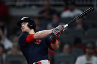 Boston Red Sox pinch-hitter Christian Arroyo follows through on a grand slam in the seventh inning of the team's baseball game against the Atlanta Braves on Wednesday, June 16, 2021, in Atlanta. (AP Photo/John Bazemore)