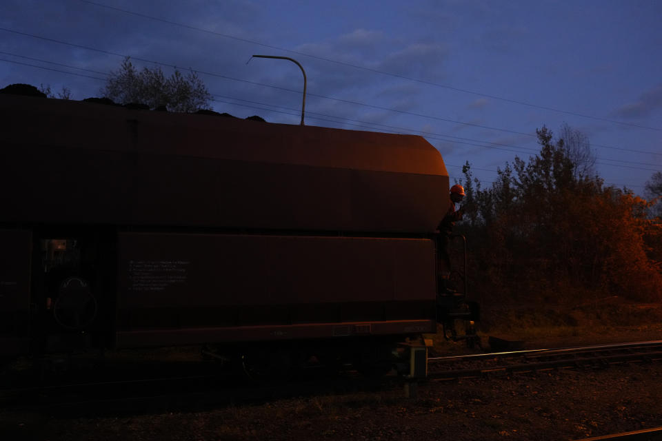 A train carrying coal is moved by a coal mine near Ostrava, Czech Republic, Thursday, Nov. 10, 2022. High energy prices linked to Russia's war in Ukraine have paved the way for coal’s comeback, endangering climate goals and threatening health from increased pollution. (AP Photo/Petr David Josek)