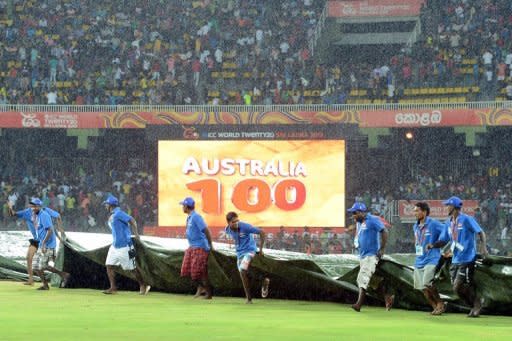 Ground staff at the Premadasa Stadium in Colombo cover the pitch as rain stops play during the World Twenty20 on September 22. In Colombo, Australia were 100-1 in 9.1 overs chasing West Indies' total of 191-8 when heavy rain forced the match to be called off in front of 18,000 fans