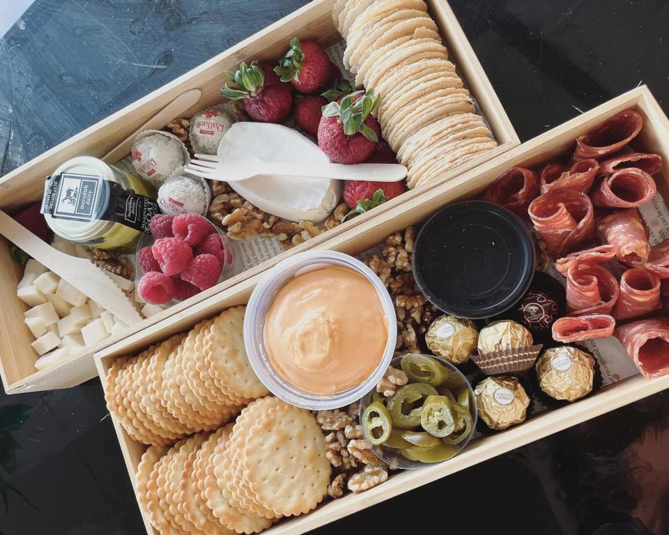 Beautiful savoury and sweet picnic grazing platters laid out in Kmart bamboo organisers for ease of transport