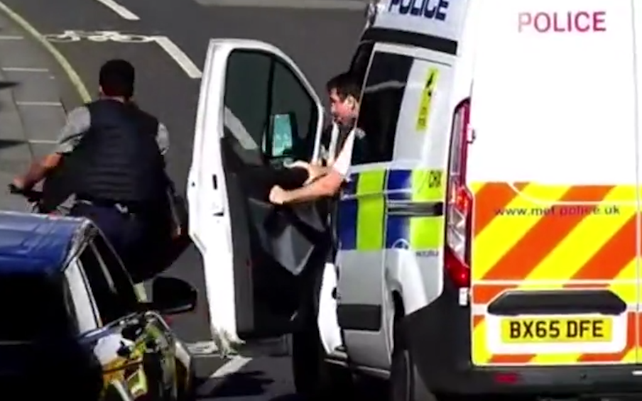 Jake Nedd being knocked off bike by police - Credit: SWNS