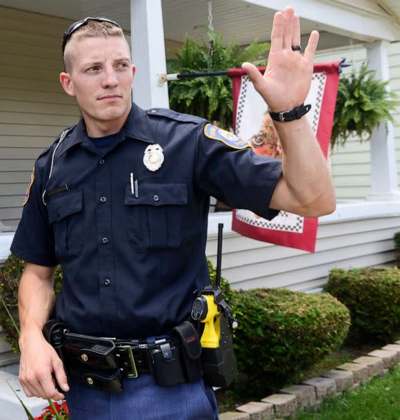 PHOTO: Police Officer Christopher Schurr stops to talk with a resident in Grand Rapids, Mich., Aug. 12, 2015.  (Emily Rose Bennett/AP, FILE)