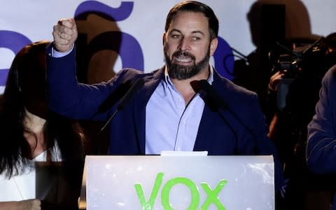 Santiago Abascal, leader of far right party Vox, addresses supporters outside the party headquarters after the general election in Madrid - Credit: AP