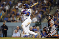 Los Angeles Dodgers' Hanser Alberto follows through on an RBI double against the San Francisco Giants during the third inning of a baseball game Thursday, July 21, 2022, in Los Angeles. (AP Photo/Marcio Jose Sanchez)