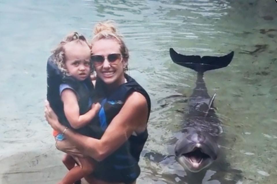 <p>Instagram/brittanylynne</p> Brittany Mahomes and daughter Sterling with dolphin