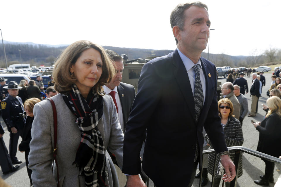 Virginia Gov. Ralph Northam, left, and his wife Pam, left, leave the funeral of fallen Virginia State Trooper Lucas B. Dowell after the church service for the funeral at the Chilhowie Christian Church in Chilhowie, Va., Saturday, Feb. 9, 2019. Dowell was killed in the line of duty earlier in the week. (AP Photo/Steve Helber, Pool)