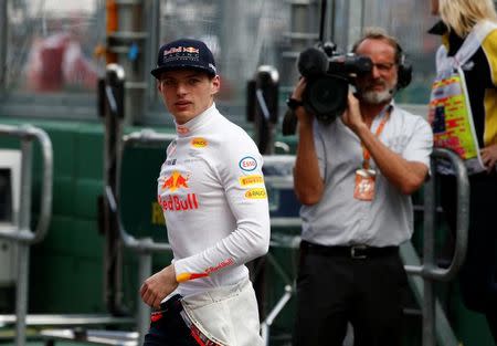 Formula One - F1 - Australian Grand Prix - Melbourne, Australia - 25/03/2017 Red Bull Racing driver Max Verstappen of the Netherlands walks in pit lane before the start of the qualifying session. REUTERS/Brandon Malone