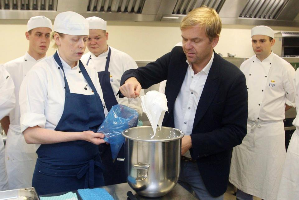 Granger, centre, right, with Royal Pastry Chef Kathryn Boyden, centre left, and other royal chefs at Buckingham Palace as they make pavlova before a reception in advance of the Royal Visit to Australia