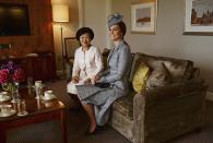 Britain's Catherine, Duchess of Cambridge (R) sits with Mary Chee, the wife of the President of Singapore Tony Tan, as the Princess and her husband Prince William greet the President and his wife at the Royal Garden Hotel in London October 21, 2014. The President and his wife will be guests of Queen Elizabeth during the first state visit of a Singapore President to Britain. REUTERS/Anthony Devlin/pool (BRITAIN - Tags: POLITICS ROYALS ENTERTAINMENT TPX IMAGES OF THE DAY)