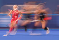 <p>Japan's Hazuki Nagai (left) carries the ball on July 26 during the women's pool B match field hockey competition against New Zealand.</p>