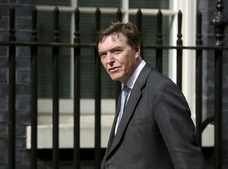 Philip Dunne arrives at 10 Downing Street in central London, Britain in this May 11, 2015 file photo. REUTERS/Neil Hall