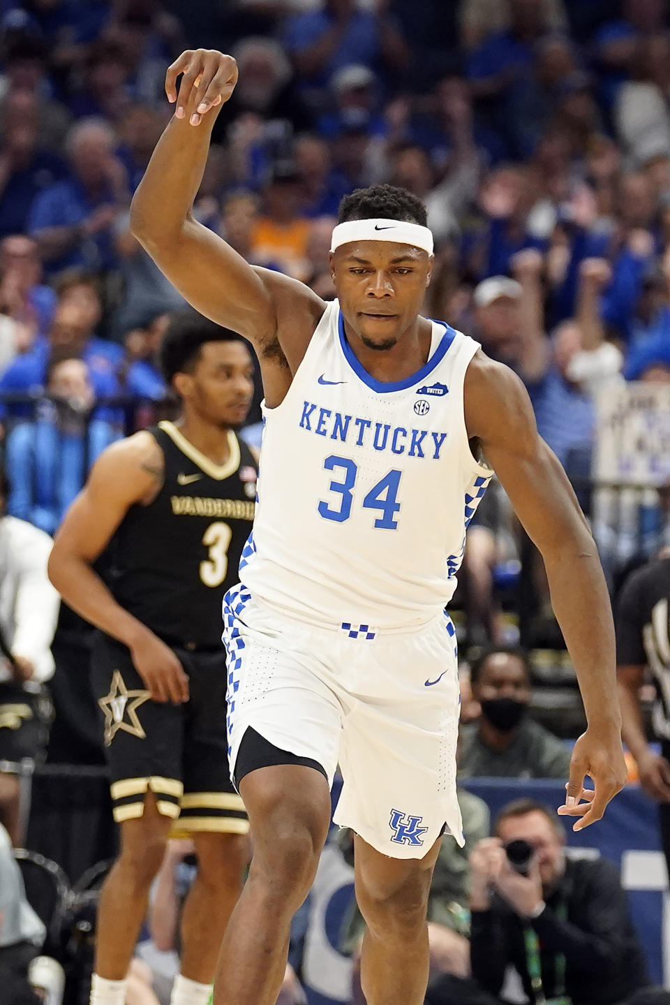 Kentucky forward Oscar Tshiebwe (34) celebrates after making a shot against Vanderbilt during the first half of an NCAA college basketball game in the Southeastern Conference men's tournament Friday, March 11, 2022, in Tampa, Fla. (AP Photo/Chris O'Meara)