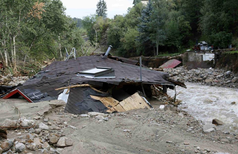 A destroyed house lies on the banks of the James Creek in Jamestown, Colorado, after a flash flood destroyed much of the town, September 14, 2013. Relentless rains pounded flood-ravaged eastern Colorado for a fifth day on Saturday, triggering more evacuations and warnings as rescuers tried to reach thousands of people displaced or stranded by the deluge that has been blamed for at least four deaths. REUTERS/Rick Wilking