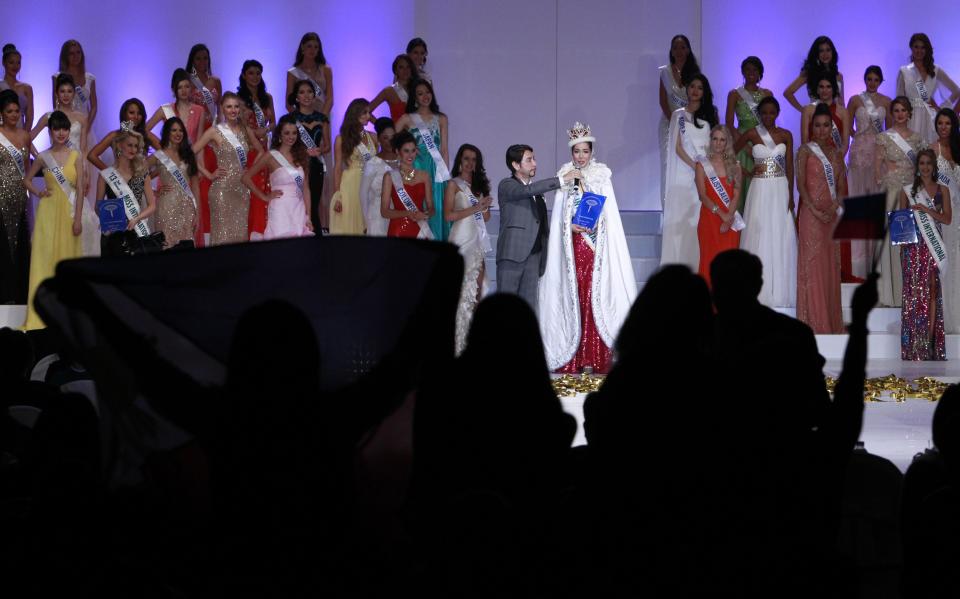 Newly crowned Miss International 2013 Santiago of the Philippines speaks on stage during the pageant in Tokyo