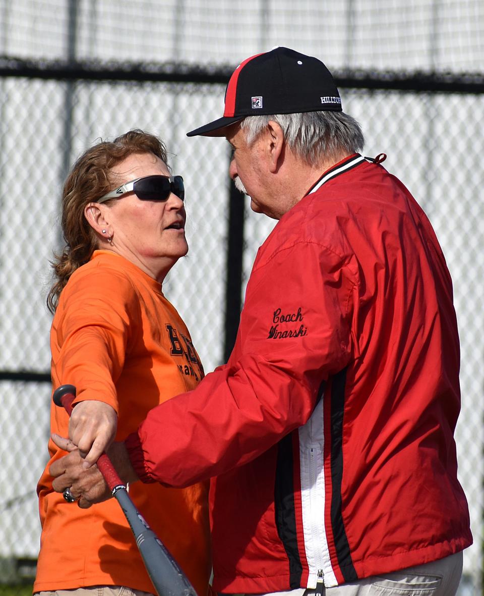 Steve Winarski hugs Diman coach Cathie Noversa during Tuesday's field dedication May 14, 2024.