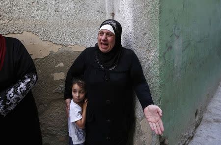 A relative of Issa al Qitri, a Palestinian man who was killed by Israeli troops, mourns during his funeral at al-Amari camp near the West Bank city of Ramallah September 10, 2014. REUTERS/Mohamad Torokman