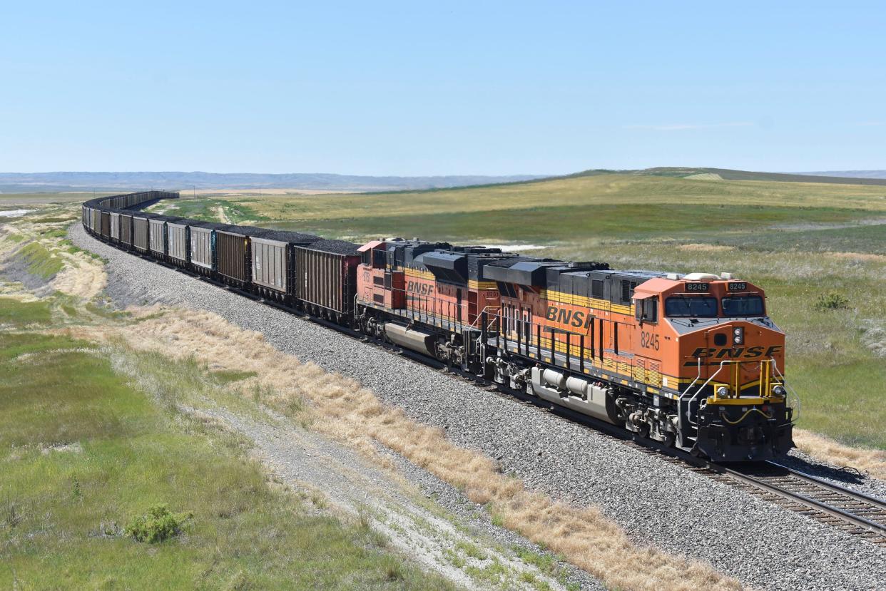 A BNSF railroad train hauling carloads of coal from the Powder River Basin of Montana and Wyoming is seen east of Hardin, Mont., on July 15, 2020. BNSF railroad's two biggest unions that represent 17,000 workers won't be able to go on strike over a new attendance policy they say would penalize employees for missing work for any reason, a federal judge ruled Tuesday, Jan. 25, 2022.