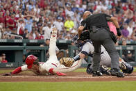 New York Yankees catcher Kyle Higashioka tags out St. Louis Cardinals' Nolan Gorman, left, at home as home plate umpire Vic Carapazza, right, watches the play during the third inning of a baseball game Saturday, Aug. 6, 2022, in St. Louis. (AP Photo/Jeff Roberson)