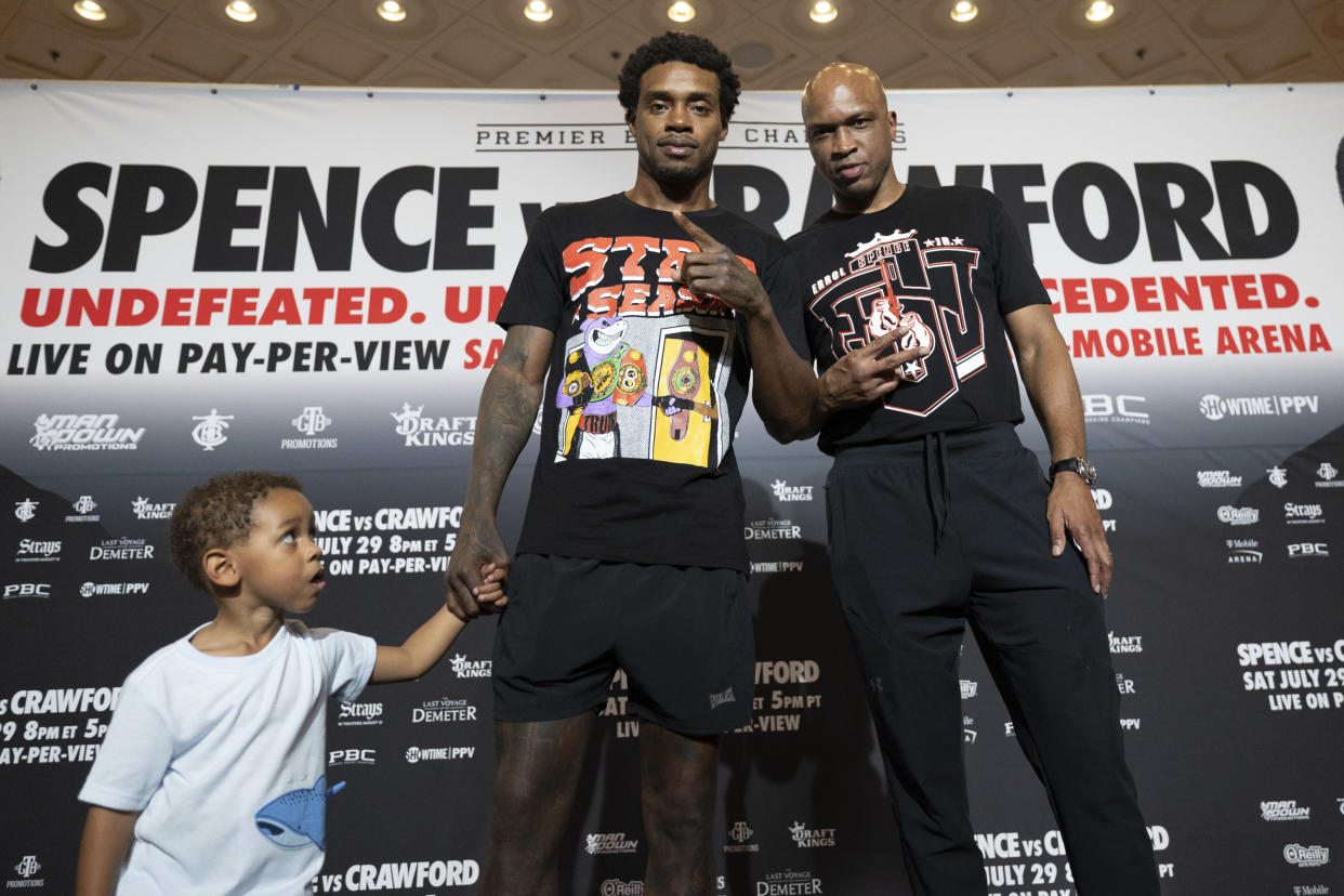 IBF-WBA-WBC welterweight champion Errol Spence Jr. (middle) with his son and trainer Derrick James arrives at the MGM Grand for his fight on Saturday with Terence Crawford. (Esther Lin/Showtime)