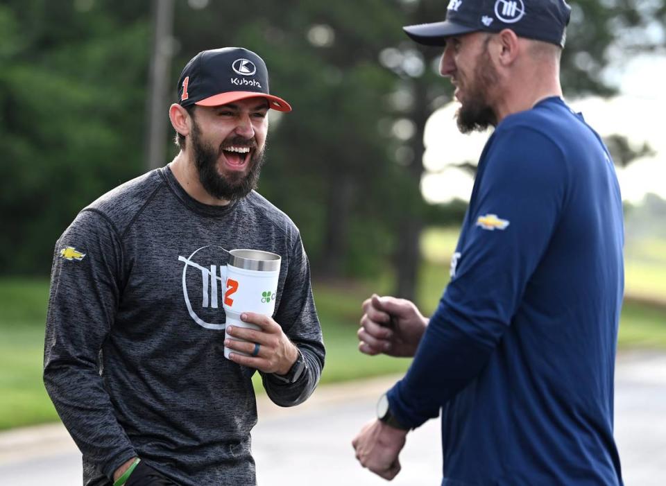 Michael Roberts, the front tire changer, left and tire carrier Matt Simmons, right, for NASCAR driver Ross Chastain’s Trackhouse Racing pit crew joke around prior to practice on Tuesday, June 11, 2024.