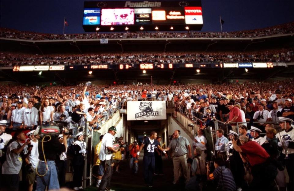 Adam Taliaferro enters the newly expanded Beaver Stadium to the the cheers of over 109,000 people before their game against Miami on Saturday, Sept. 1, 2001.