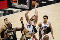 Philadelphia 76ers' Ben Simmons, top center, shoots against Atlanta Hawks' Clint Capela (15), John Collins, bottom center, and Bogdan Bogdanovic, back left, during the first half of Game 4 of a second-round NBA basketball playoff series on Monday, June 14, 2021, in Atlanta. (AP Photo/Brynn Anderson)