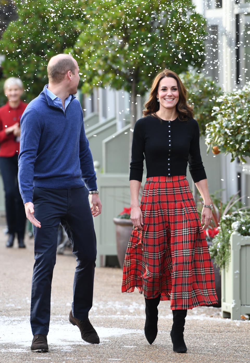 William and Kate giggle as they’re covered in fake snow (Getty)