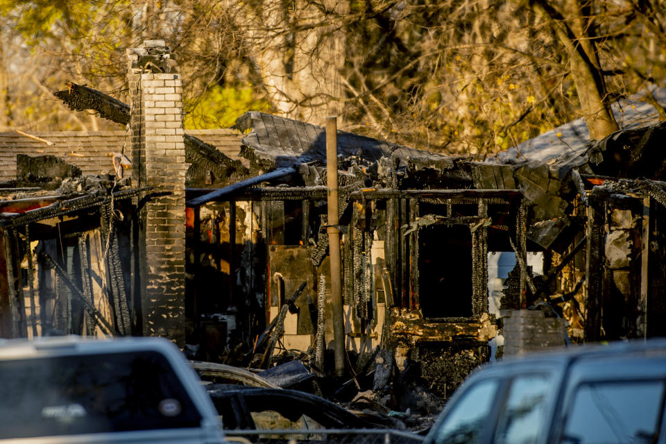 The shell of the home, seen on Tuesday morning, Nov. 23, 2021, where an explosion and house fire occurred in Flint, Mich. (Jake May/The Flint Journal via AP)