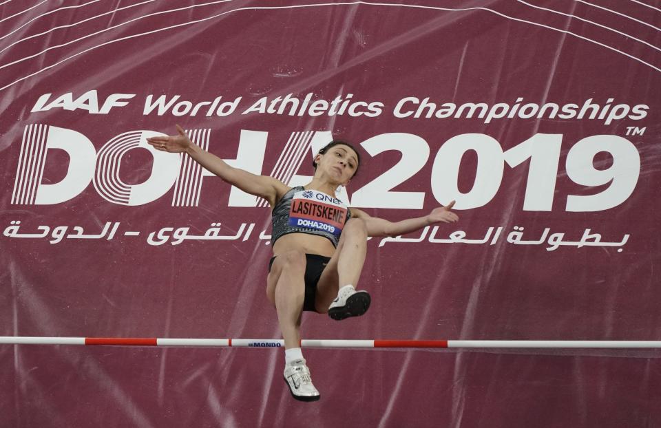 Mariya Lasitskene, of participates as a neutral athlete, clears the bar during the women's high jump finals at the World Athletics Championships in Doha, Qatar, Monday, Sept. 30, 2019. (AP Photo/Morry Gash)