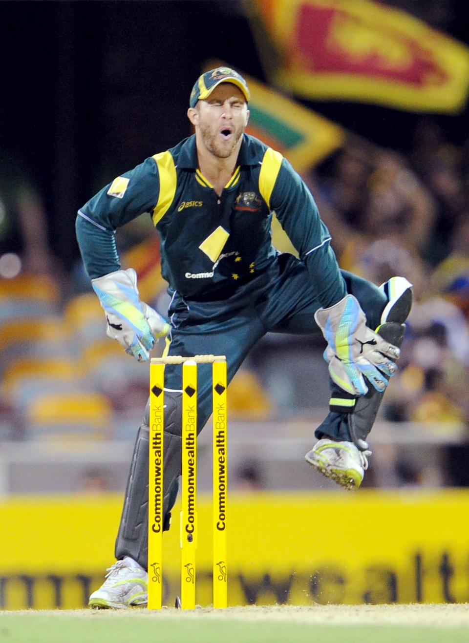Australian wicketkeeper Matthew Wade hobbles after been hit by the ball in the first international one-day cricket final at the Gabba in Brisbane, on March 4, 2012.