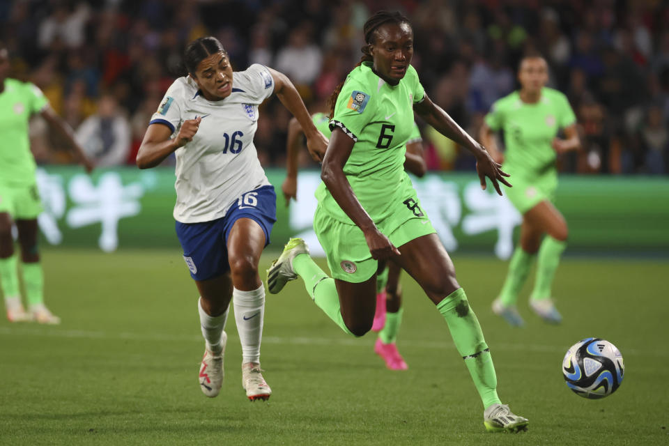 England's Jessica Carter, left, and Nigeria's Ifeoma Onumonu vie for the ball during the Women's World Cup round of 16 soccer match between England and Nigeria in Brisbane, Australia, Monday, Aug. 7, 2023. (AP Photo/Tertius Pickard)