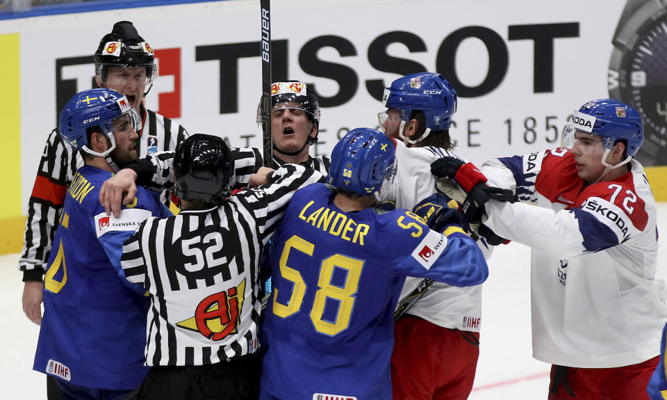 Czech Republic's and Sweden's players fight during the Ice Hockey World Championships group B match between Czech Republic and Sweden at the Andrej Nepela Arena in Bratislava, Slovakia, Friday, May 10, 2019. (AP Photo/Ronald Zak)