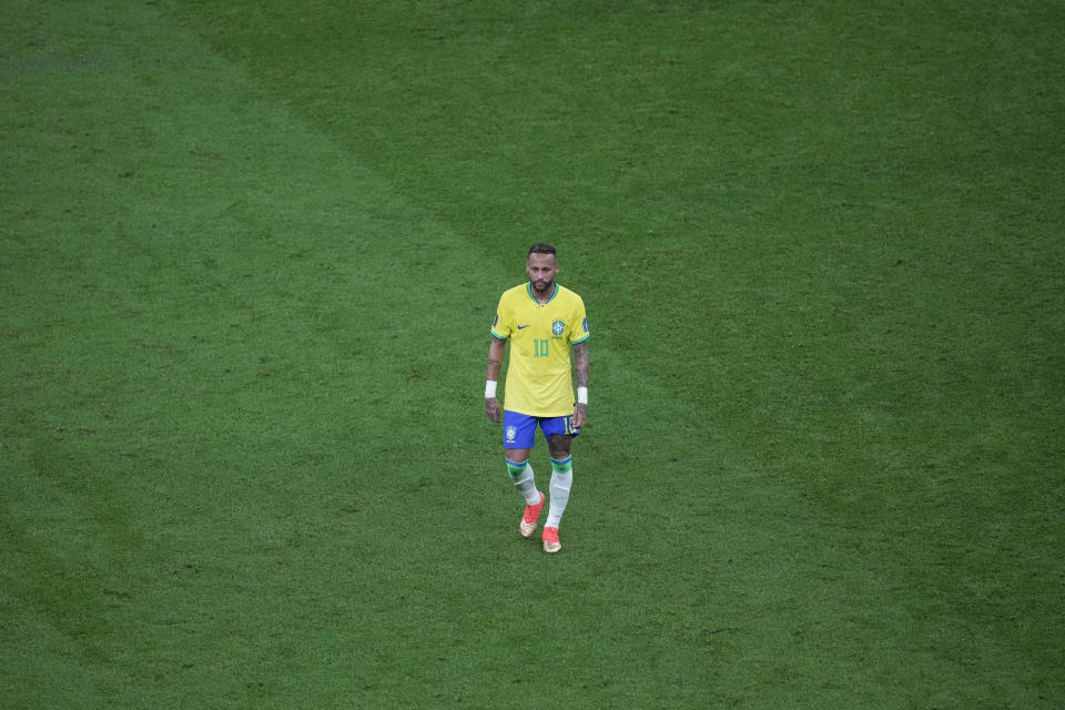 Brazil's Neymar walks on the pitch during the World Cup group G soccer match between Brazil and Serbia, at the the Lusail Stadium in Lusail, Qatar on Thursday, Nov. 24, 2022. (AP Photo/Darko Vojinovic)