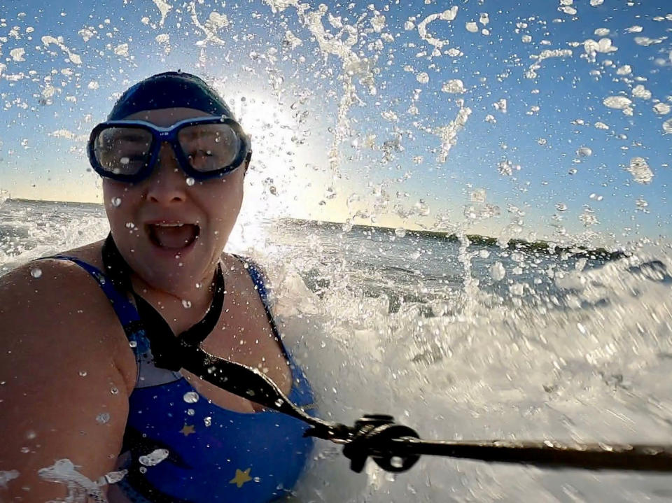 Rachel Whitfield has endured freezing temperatures to swim in wild water wearing just a costume every day for the last year. (SWNS)