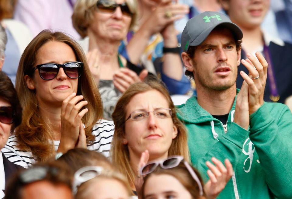 Kim and Andy Murray watch John Peers of Australia and Jamie Murray of Great Britain in action in the Final Of The Gentlemen's Doubles against Horia Tecau of Romania and Jean-Julien Rojer of Netherland during day twelve of the Wimbledon Lawn Tennis Championships at the All England Lawn Tennis and Croquet Club on July 11, 2015 in London, England
