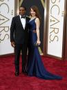 Chiwetel Ejiofor, best actor nominee for his role in "12 Years a Slave," and his girlfriend Sari Mercer arrive at the 86th Academy Awards in Hollywood, California March 2, 2014. REUTERS/Lucas Jackson (UNITED STATES - Tags: ENTERTAINMENT) (OSCARS-ARRIVALS)