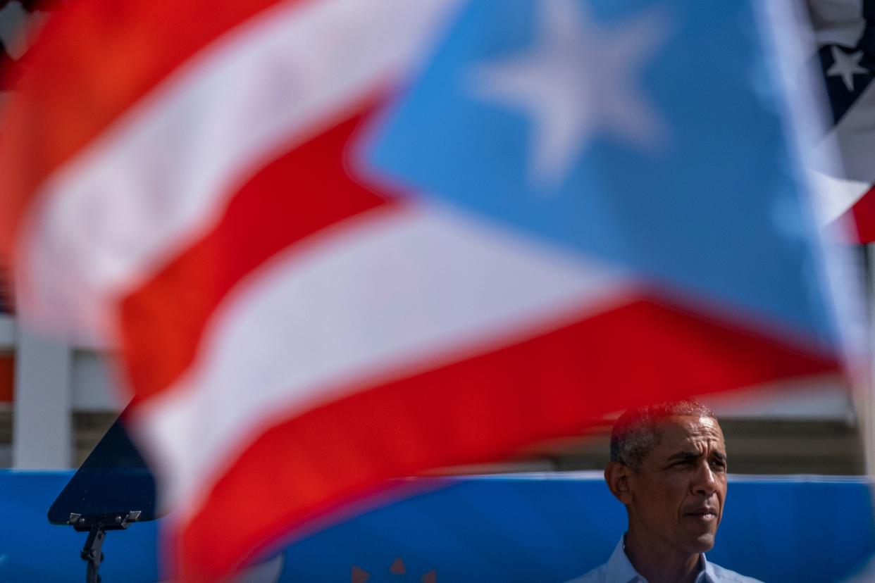 The Puerto Rican flag waves as former President Barack Obama speaks 