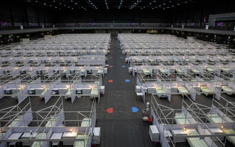 Beds for Covid-19 patients are set up in a temporary facility at the AsiaWorld Expo in Hong Kong - JEROME FAVRE/EPA-EFE/Shutterstock