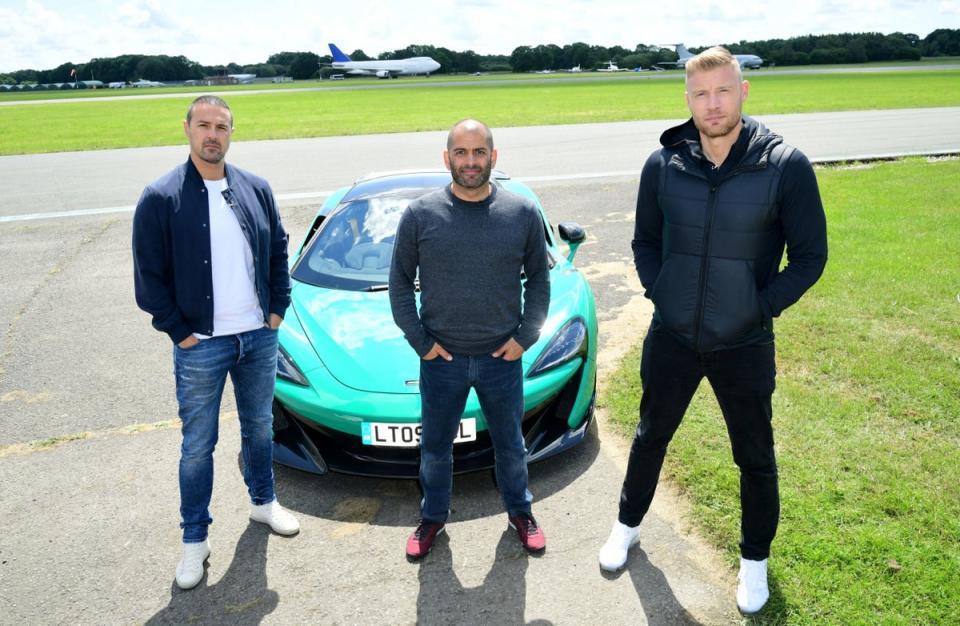 Back to business: McGuinness (L) with cast-mates Chris Harris (C) and Freddie Flintoff (R) are currently filming season 33 of Top Gear (PA)