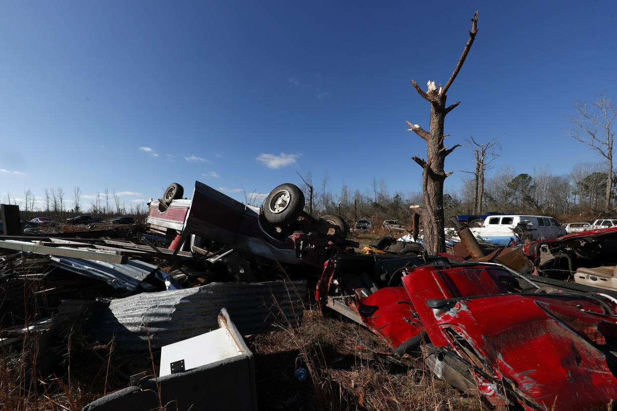 Debris stretches across a field after a tornado that ripped through Central Alabama earlier this week along County Road 140 where loss of life occurred Saturday, Jan. 14, 2023, in White City, Autauga County, Ala. (AP Photo/Butch Dill)