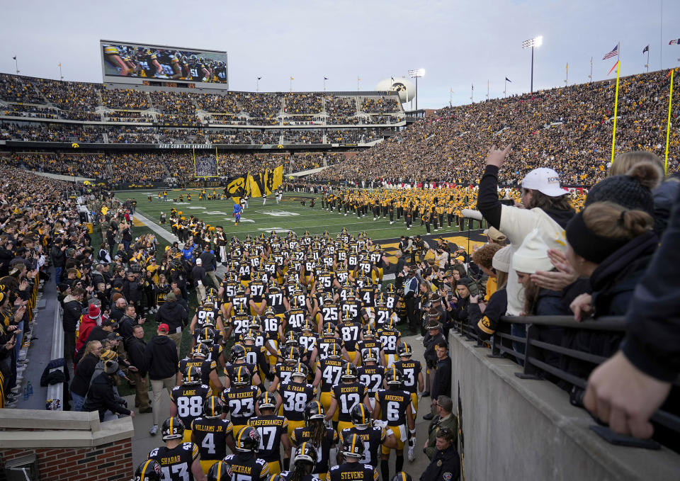 Iowa players take the field prior to kickoff against Rutgers in an NCAA college football game, Saturday, Nov. 11, 2023, in Iowa City, Iowa. (AP Photo/Bryon Houlgrave)