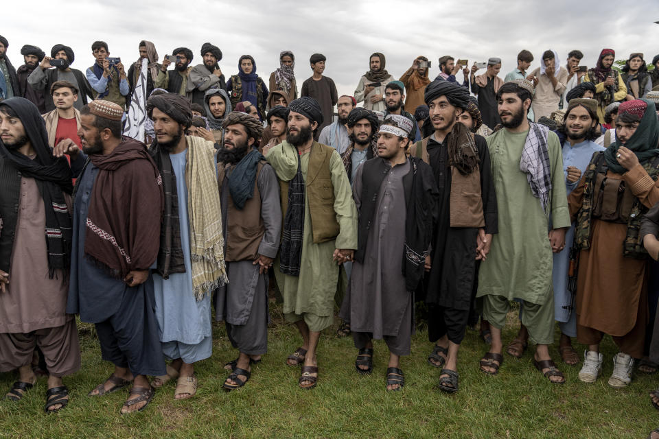 Taliban fighters celebrate one year since they seized the Afghan capital, Kabul, in Kabul, Afghanistan, Monday, Aug. 15, 2022. The Taliban marked the first-year anniversary of their takeover after the country's western-backed government fled and the Afghan military crumbled in the face of the insurgents' advance. (AP Photo/Ebrahim Noroozi)