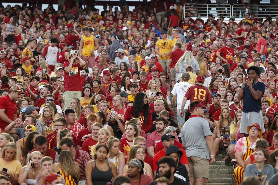 Fans are asked to leave the stadium after lightning was spotted during as Iowa State takes on South Dakota State in an NCAA college football game, Saturday, Sept. 1, 2018, in Ames, Iowa. (AP Photo/Matthew Putney)