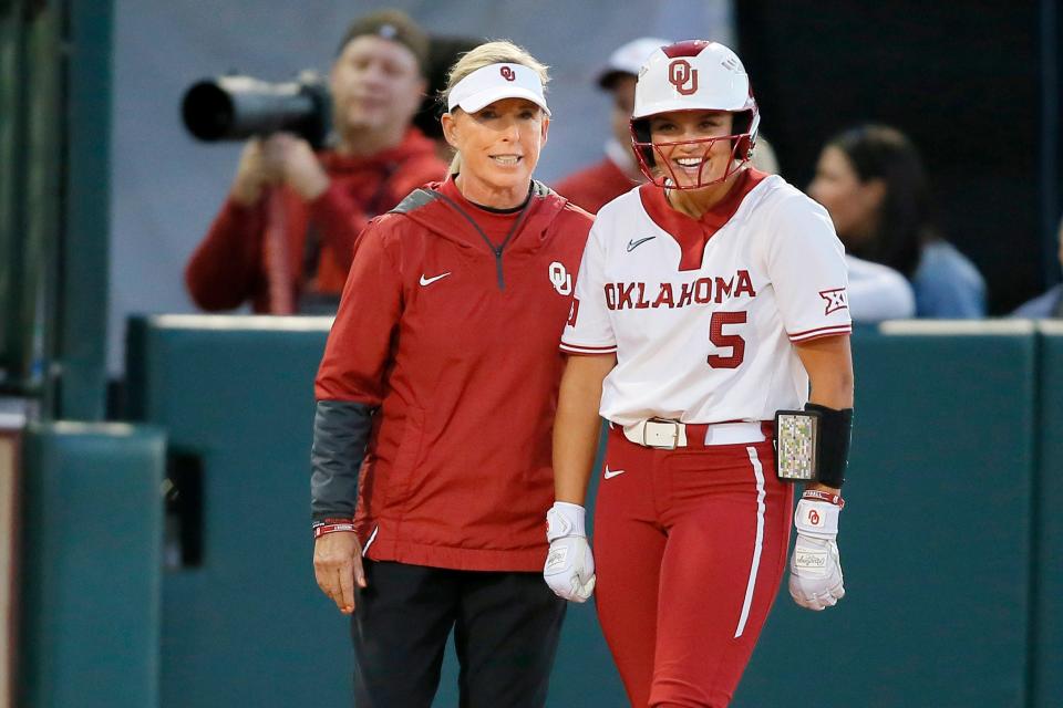 Oklahoma coach Patty Gasso talks with Oklahoma's Taylon Snow (5) during a Bedlam softball game between the University of Oklahoma Sooners (OU) and the Oklahoma State University Cowgirls (OSU) at Marita Hynes Field in Norman, Okla., Thursday, May 5, 2022. Oklahoma won 7-1.