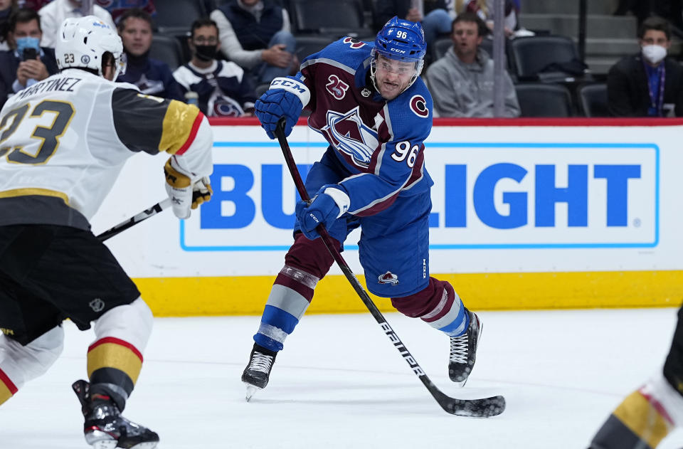 Colorado Avalanche right wing Mikko Rantanen (96) shoots against the Vegas Golden Knights during the second period in Game 2 of an NHL hockey Stanley Cup second-round playoff series Wednesday, June 2, 2021, in Denver. (AP Photo/Jack Dempsey)