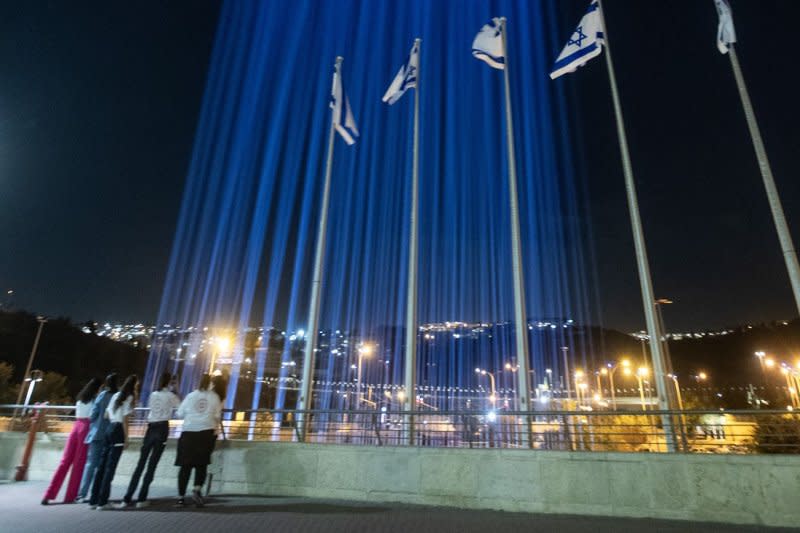 Beams of light illuminate a vigil for the Israelis being held hostage by Hamas on Sunday. Photo by Jim Hollander/UPI