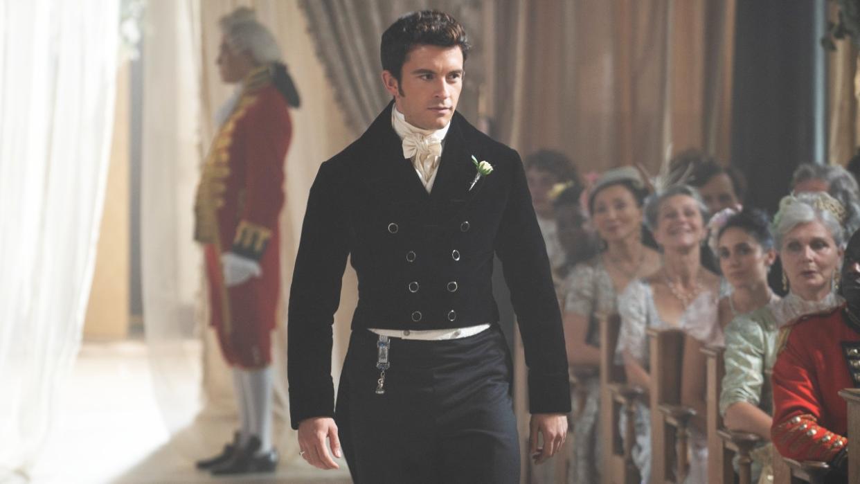  Jonathan Bailey as Anthony Bridgerton walking down an aisle at a ceremony in Season 2 of Bridgerton. 