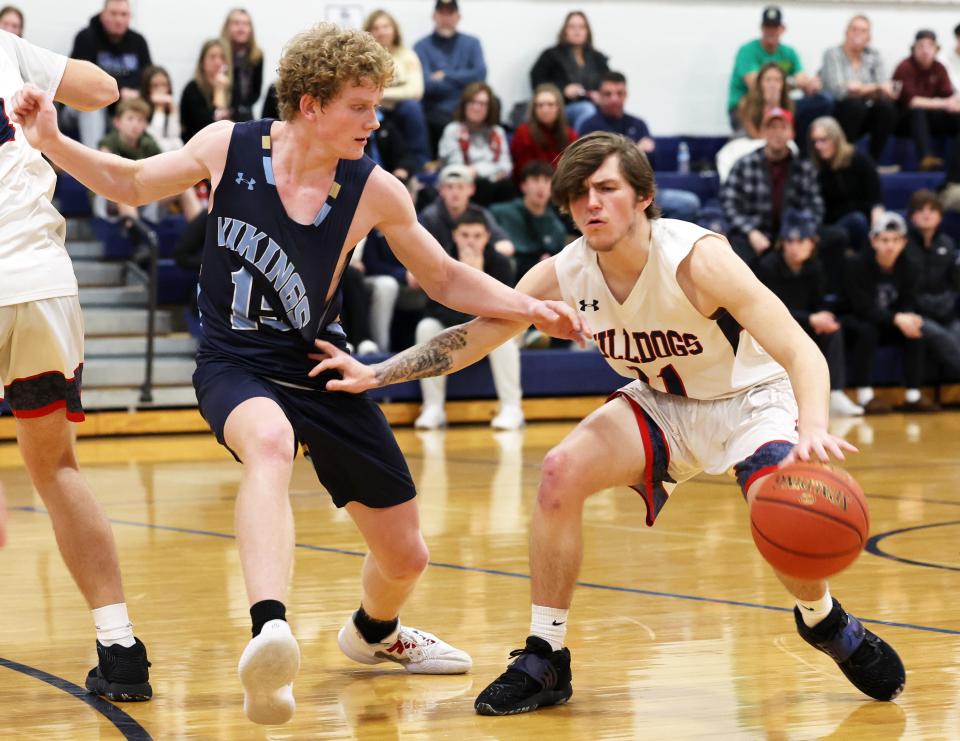 Rockland's Gaven Wardwell is defended by East Bridgewater's Aidan Toomey during a game on Tuesday, Jan. 17, 2023.
