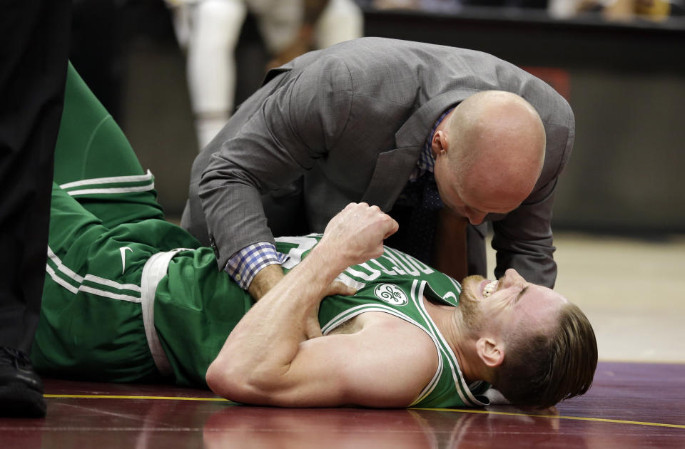 The Celtics’ Gordon Hayward is tended to after his serious ankle and leg injury. (AP)